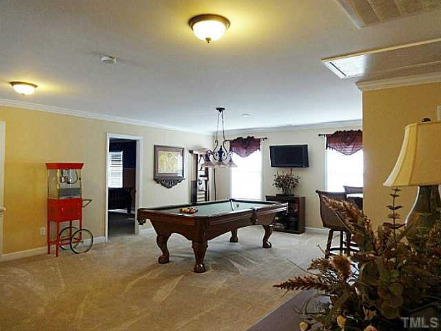 3212 Queensland Road Raleigh, NC 27614 - Photo 15 of 25 Oversize bonus room looks down into the living room. Large enough for a pool table but can be also be quaint enough for a library. Have movie night or just read a book. Let your imagination take over. Full bath close by. Bonus Room