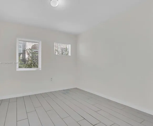 an empty room with a bench