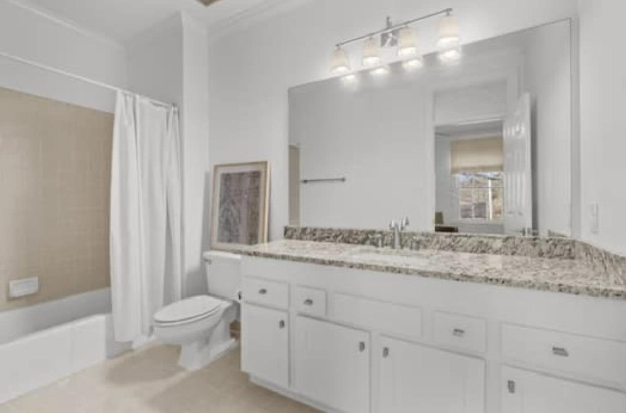 1687 Kimbrough Road, Unit 1687 Germantown, TN 38138 - Photo 13 of 20 a bathroom with a granite countertop sink mirror vanity and toilet