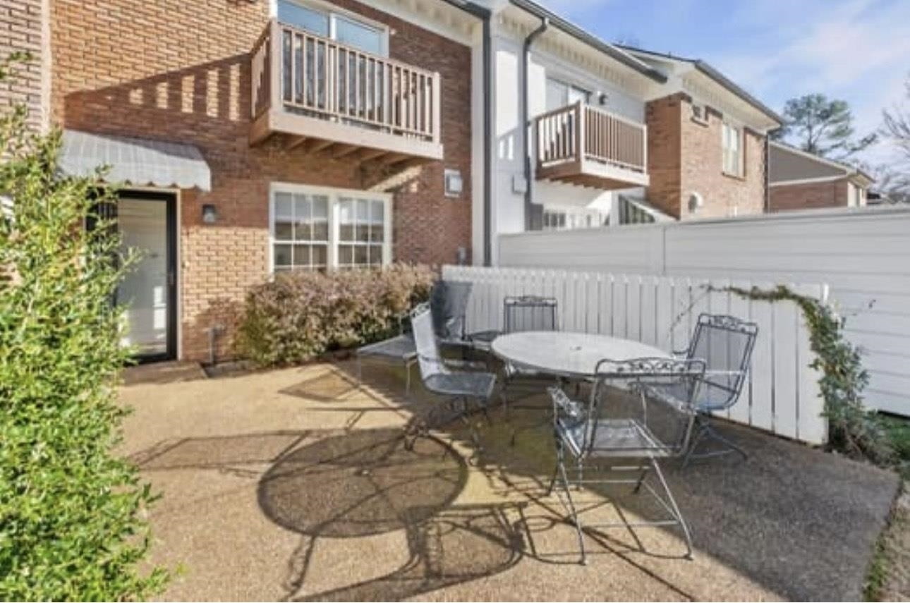 1687 Kimbrough Road, Unit 1687 Germantown, TN 38138 - Photo 14 of 20 a view of a chair and table in backyard of the house