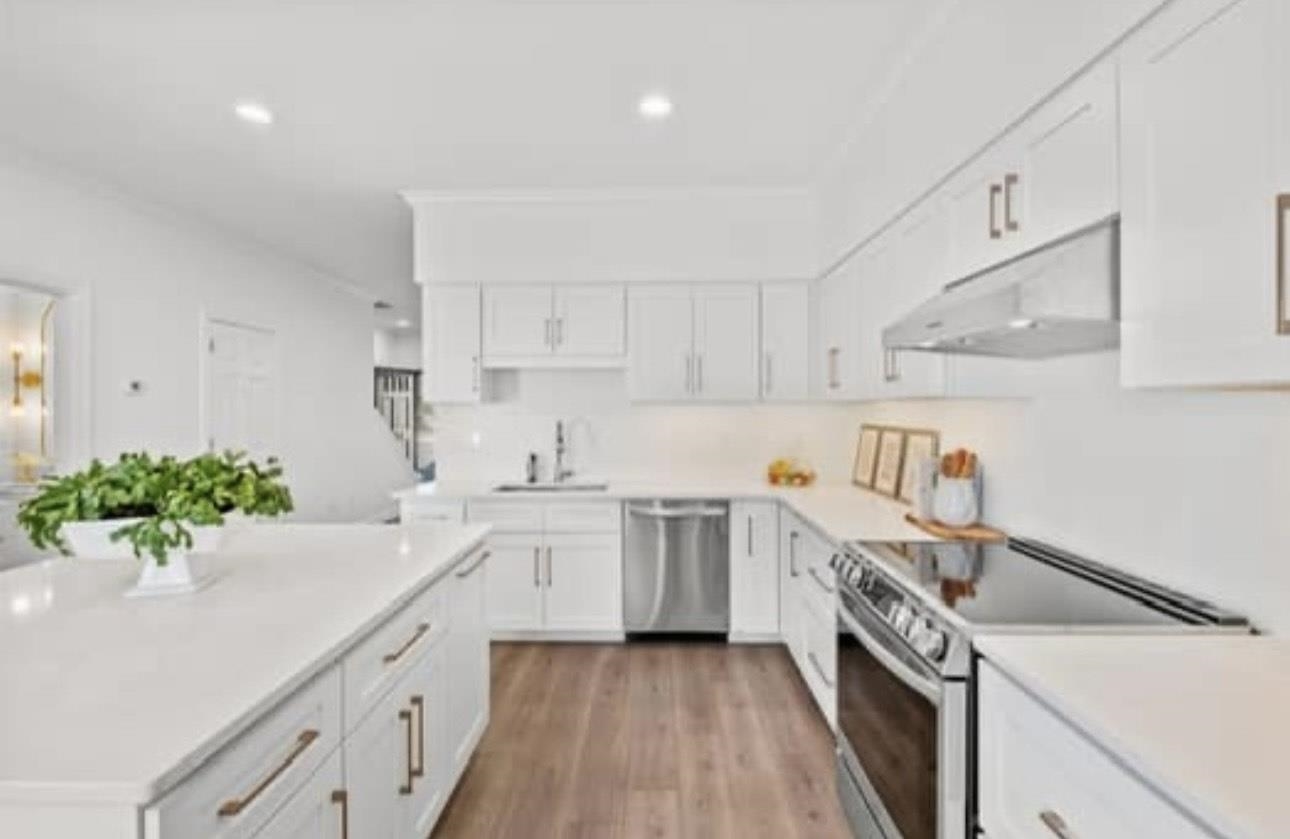 1687 Kimbrough Road, Unit 1687 Germantown, TN 38138 - Photo 4 of 20 a kitchen with a sink a stove and cabinets