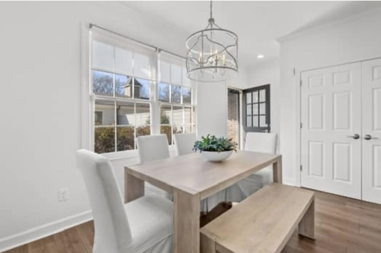 1687 Kimbrough Road, Unit 1687 Germantown, TN 38138 - Photo 5 of 20 a view of a dining room with furniture and wooden floor