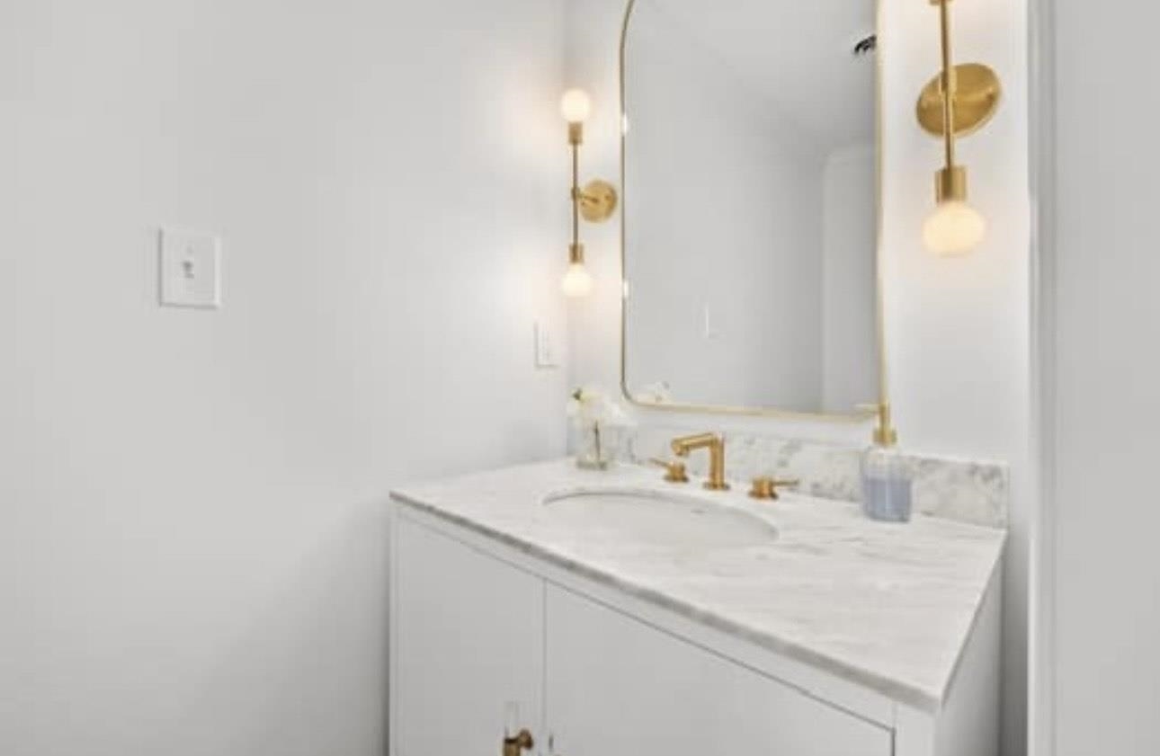 1687 Kimbrough Road, Unit 1687 Germantown, TN 38138 - Photo 9 of 20 a bathroom with a sink and a mirror