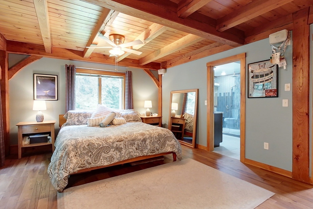 23 A Heald Street Pepperell, MA 01463 - Photo 15 of 42 a bedroom with a large bed and a window