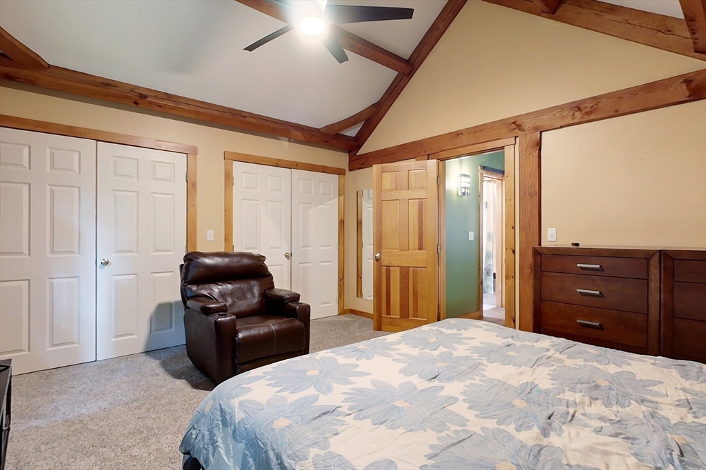 23 A Heald Street Pepperell, MA 01463 - Photo 23 of 42 a bedroom with a bed and wooden floor