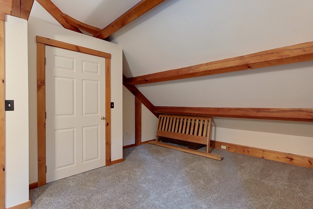 23 A Heald Street Pepperell, MA 01463 - Photo 25 of 42 a view of a livingroom with entryway and stairs