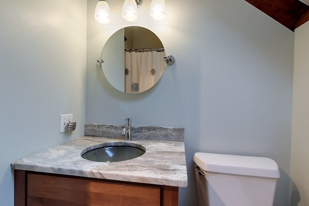 23 A Heald Street Pepperell, MA 01463 - Photo 28 of 42 a bathroom with a sink and a toilet