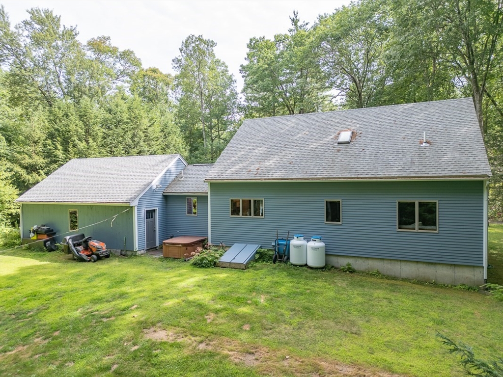 23 A Heald Street Pepperell, MA 01463 - Photo 31 of 42 a backyard of a house with table and chairs