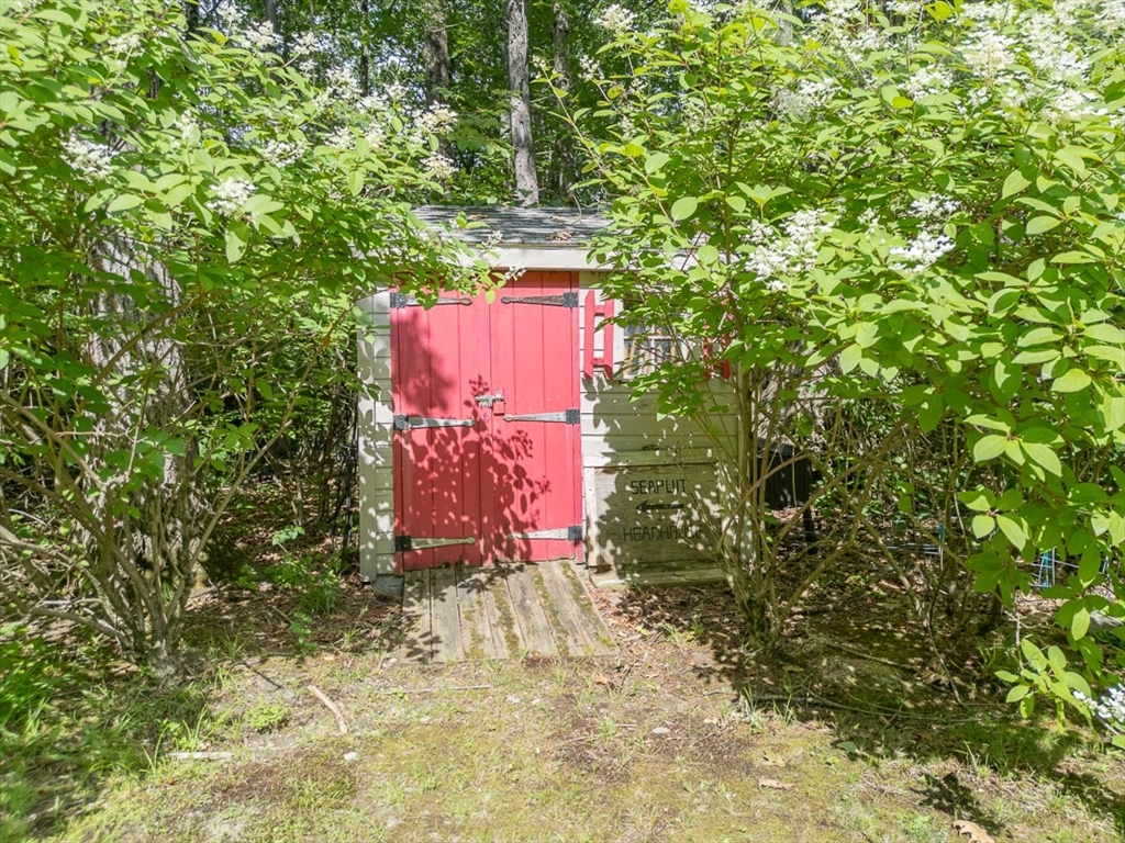 23 A Heald Street Pepperell, MA 01463 - Photo 33 of 42 a sign that is sitting in front of a tree