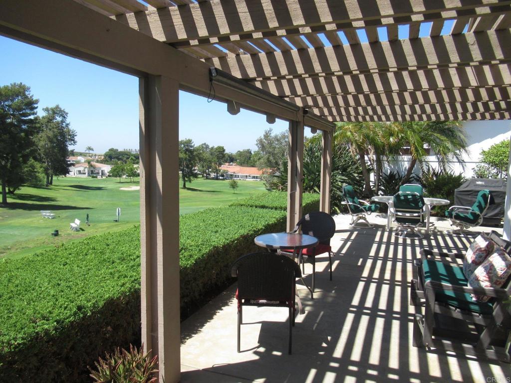 a view of a patio with a table chairs and a patio
