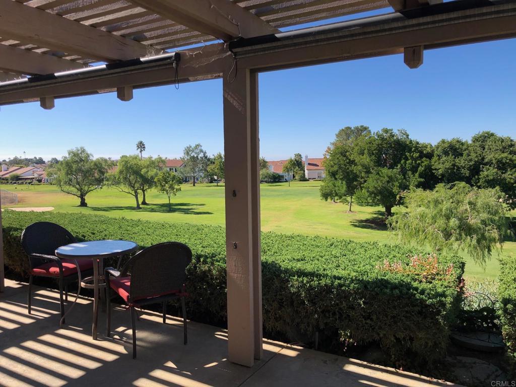 4913 Alicante Way Oceanside, CA 92056 - Photo 14 of 34 a view of a porch with furniture and yard