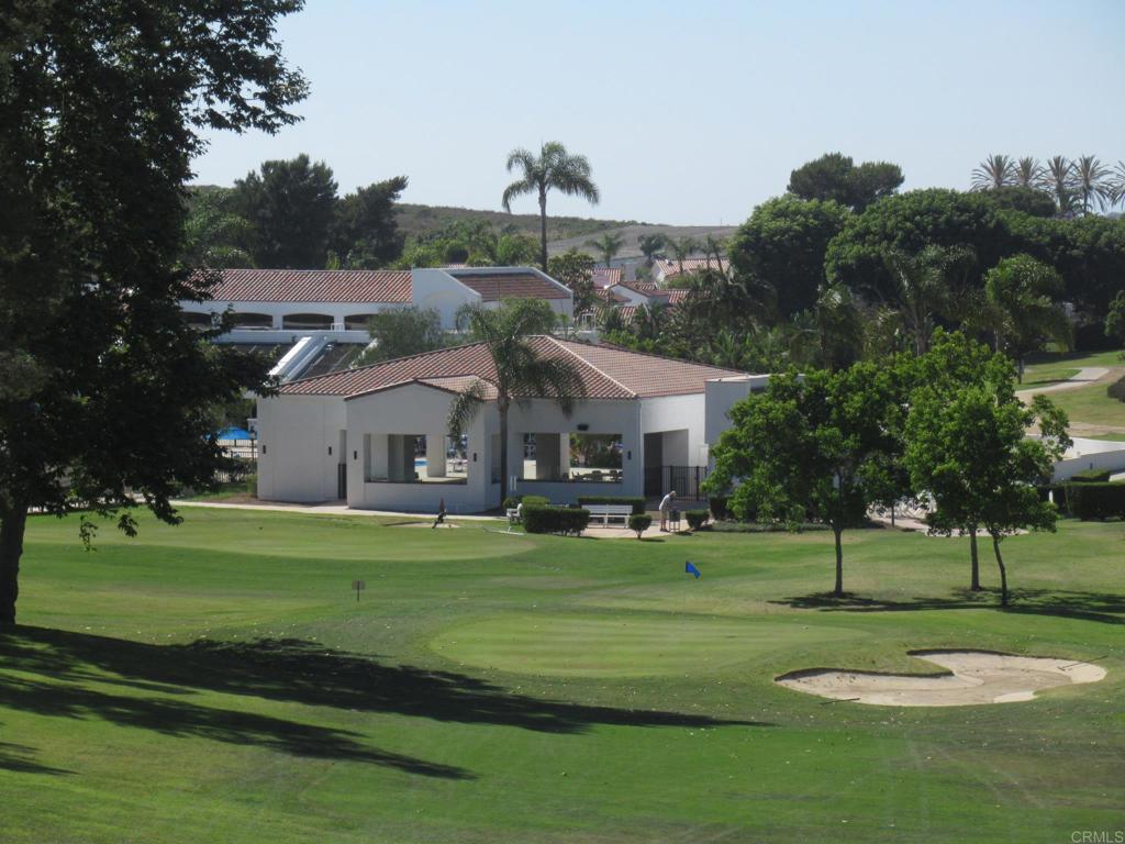 4913 Alicante Way Oceanside, CA 92056 - Photo 22 of 34 a front view of a house with a garden