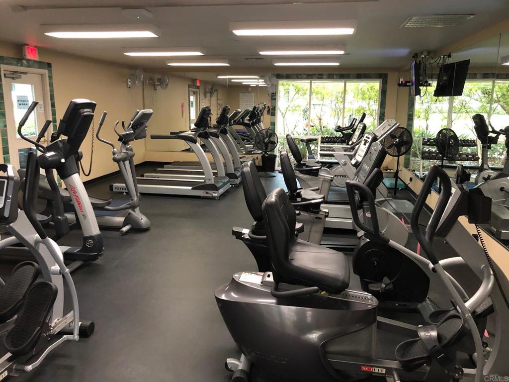 4913 Alicante Way Oceanside, CA 92056 - Photo 30 of 34 a view of a room with gym equipment