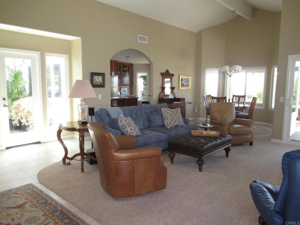 4913 Alicante Way Oceanside, CA 92056 - Photo 4 of 34 a living room with furniture and a large window