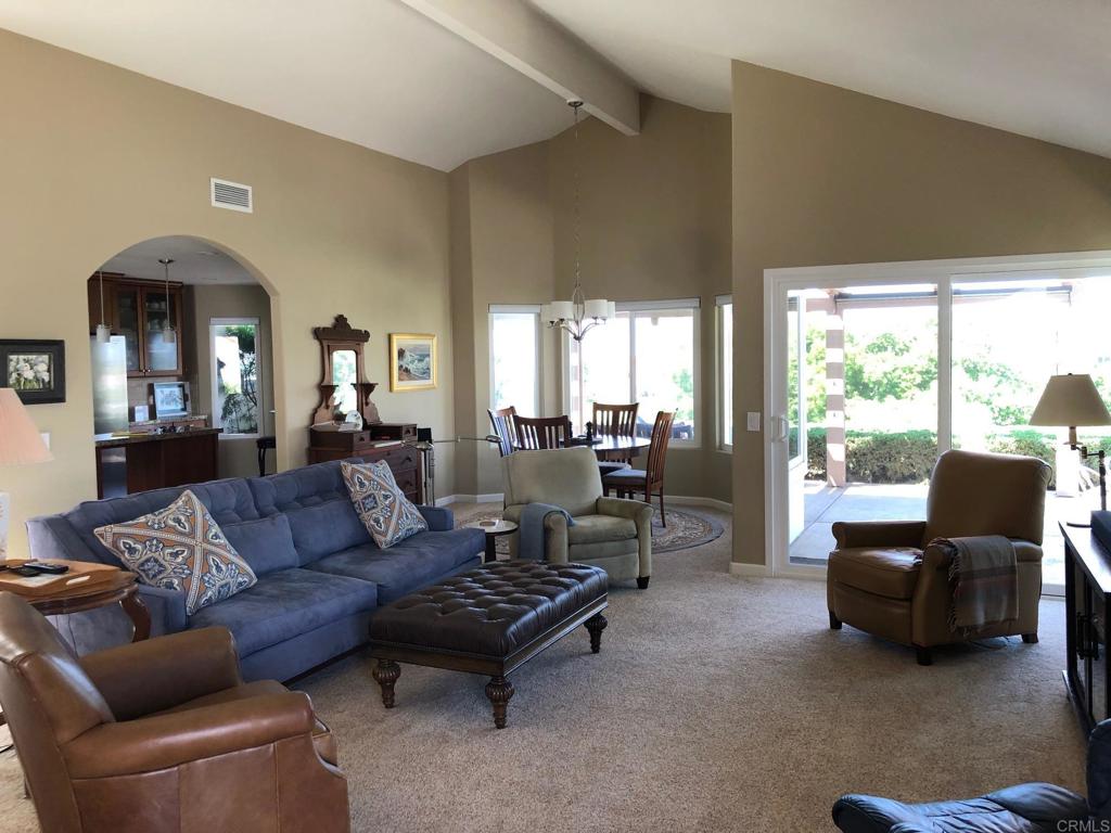 4913 Alicante Way Oceanside, CA 92056 - Photo 8 of 34 a living room with furniture and a large window
