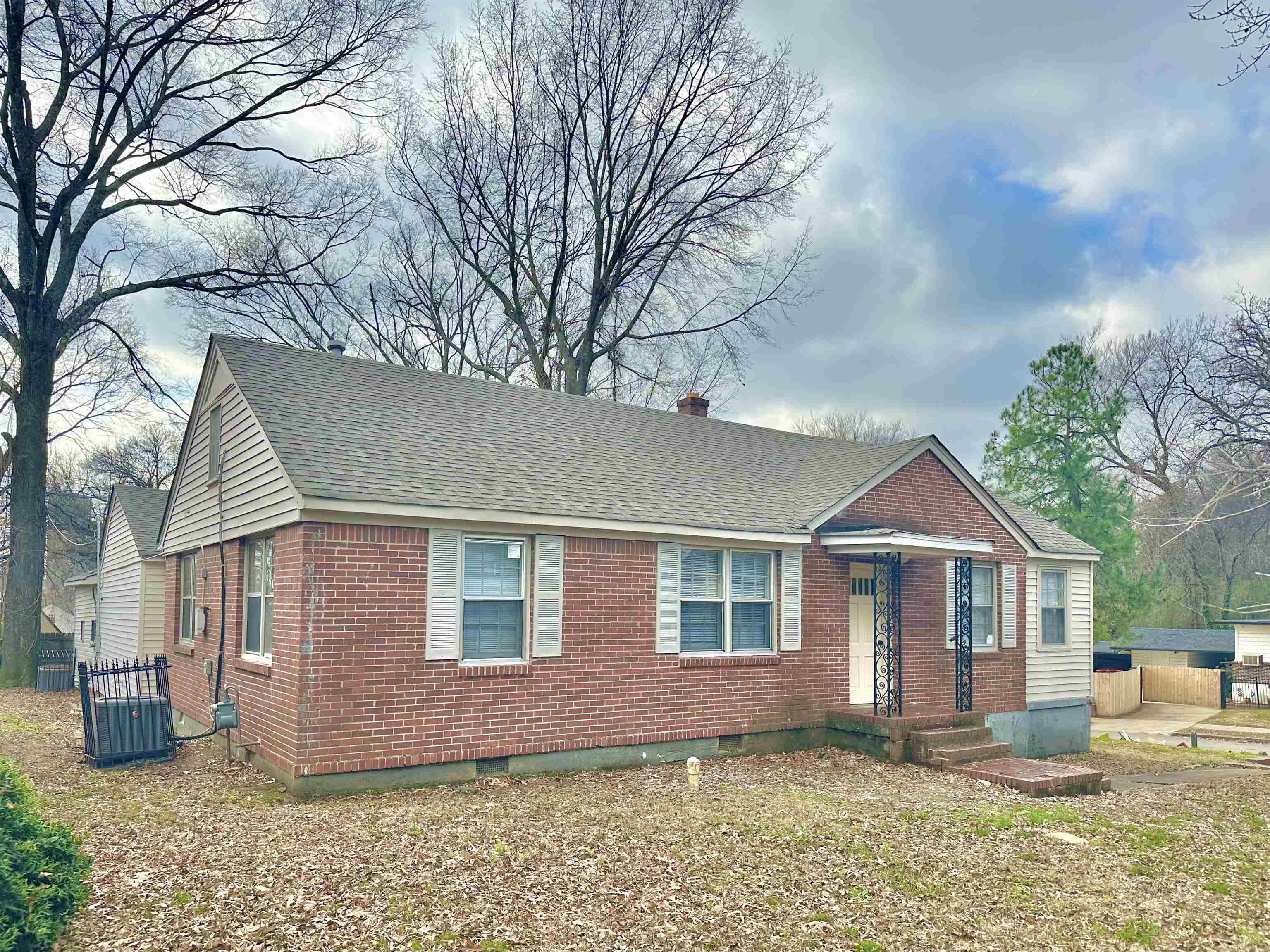 2195 Carnes Avenue Memphis, TN 38114 - Photo 1 of 30 a front view of a house with a yard
