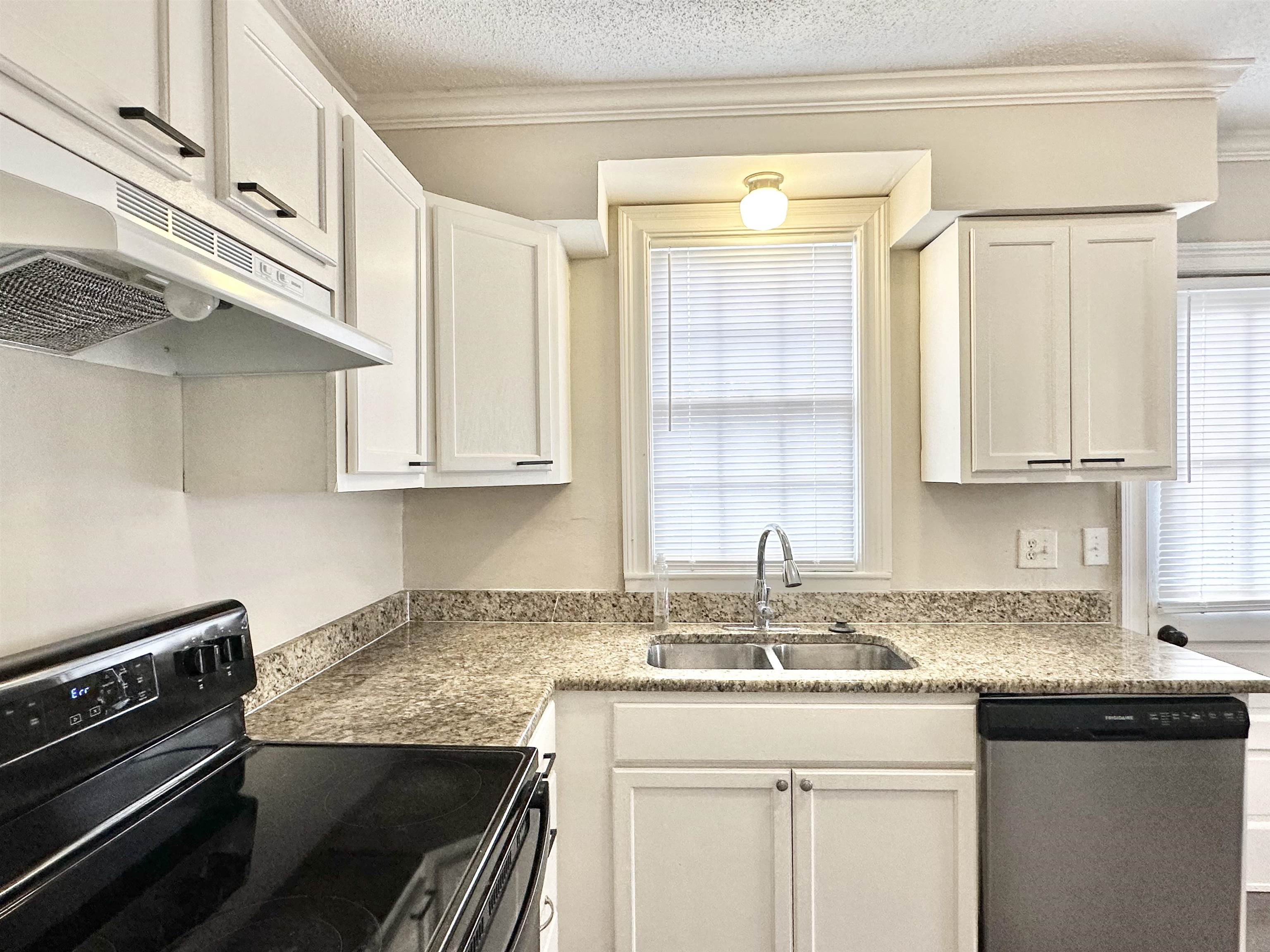 2195 Carnes Avenue Memphis, TN 38114 - Photo 4 of 30 a kitchen with granite countertop a sink stove and cabinets