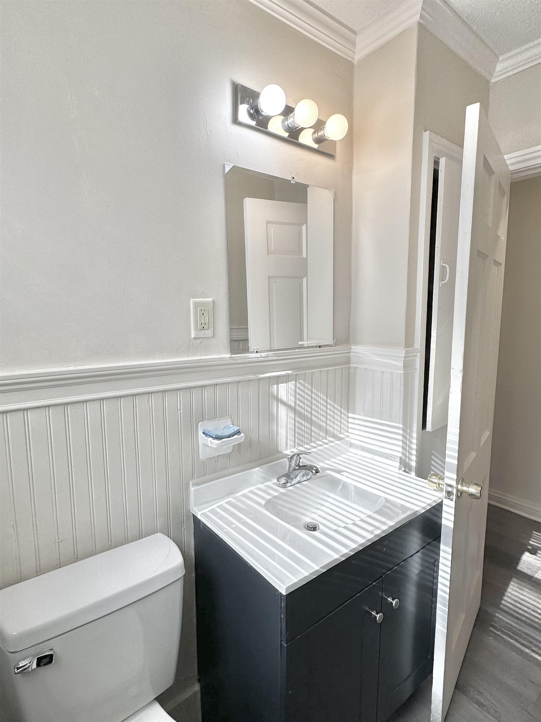2195 Carnes Avenue Memphis, TN 38114 - Photo 9 of 30 a bathroom with a granite countertop sink toilet and mirror