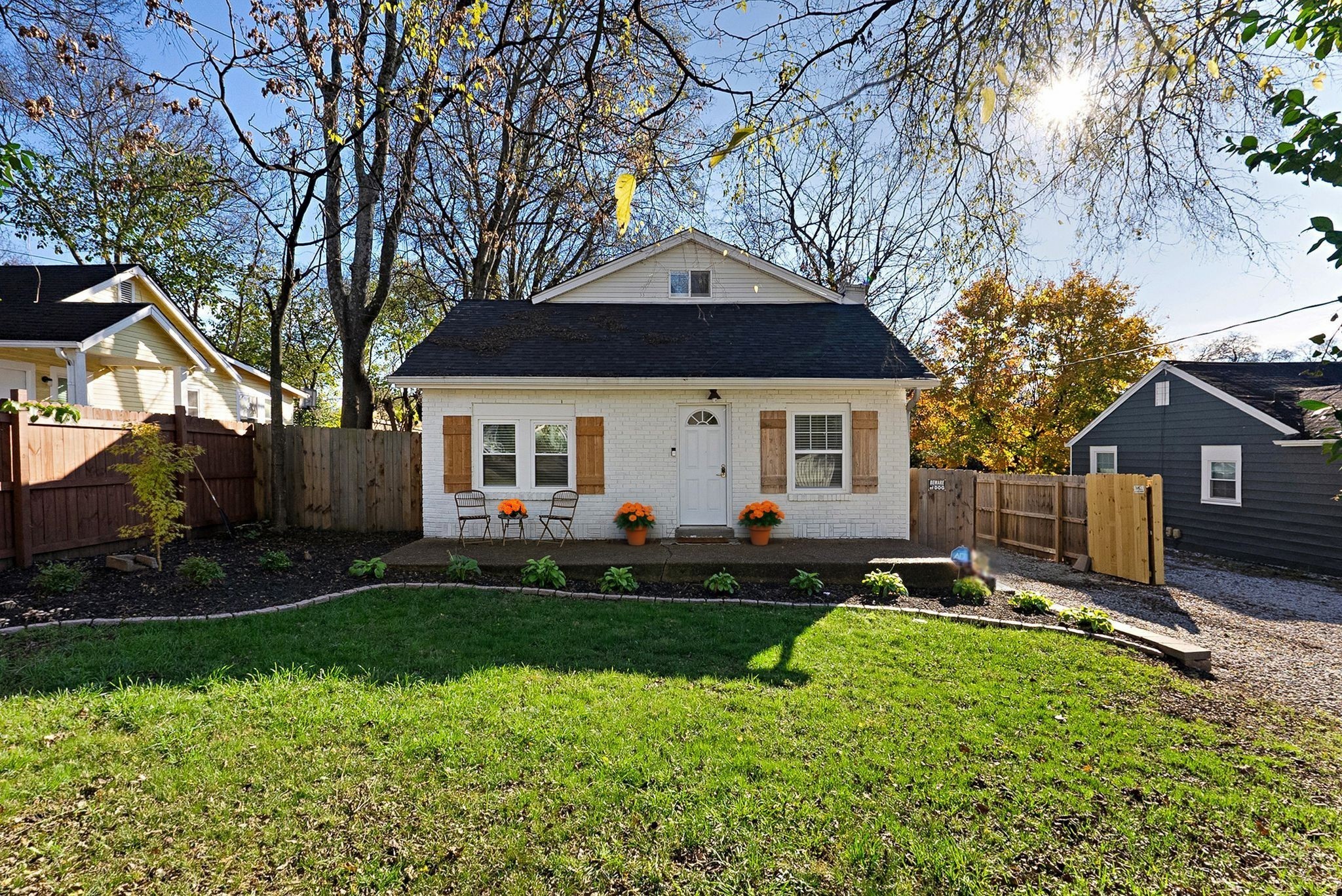 302 Dupont Avenue Madison, TN 37115 - Photo 1 of 36 a front view of a house with a yard and trees