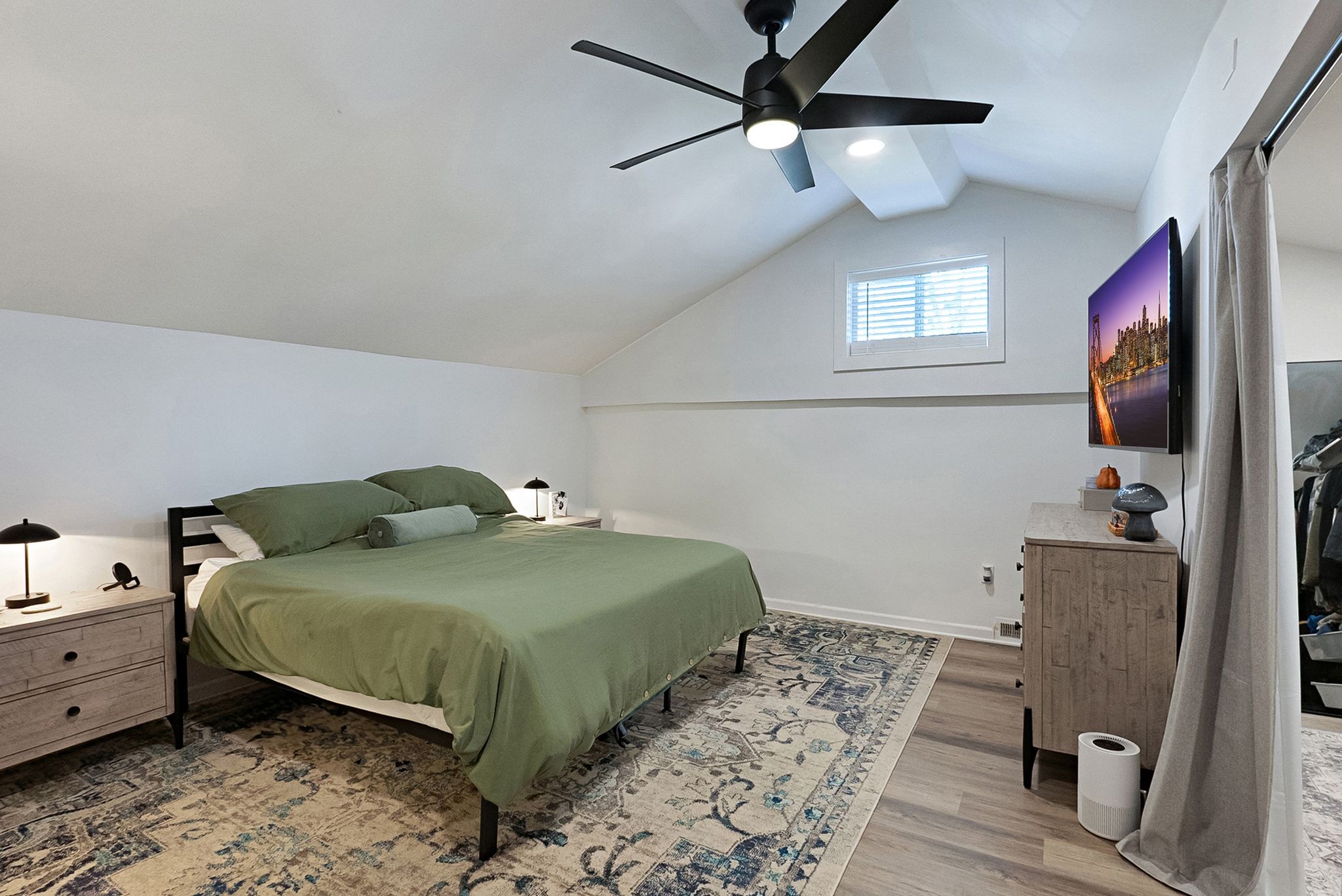 302 Dupont Avenue Madison, TN 37115 - Photo 26 of 36 a bedroom with a bed and a flat tv screen on dresser