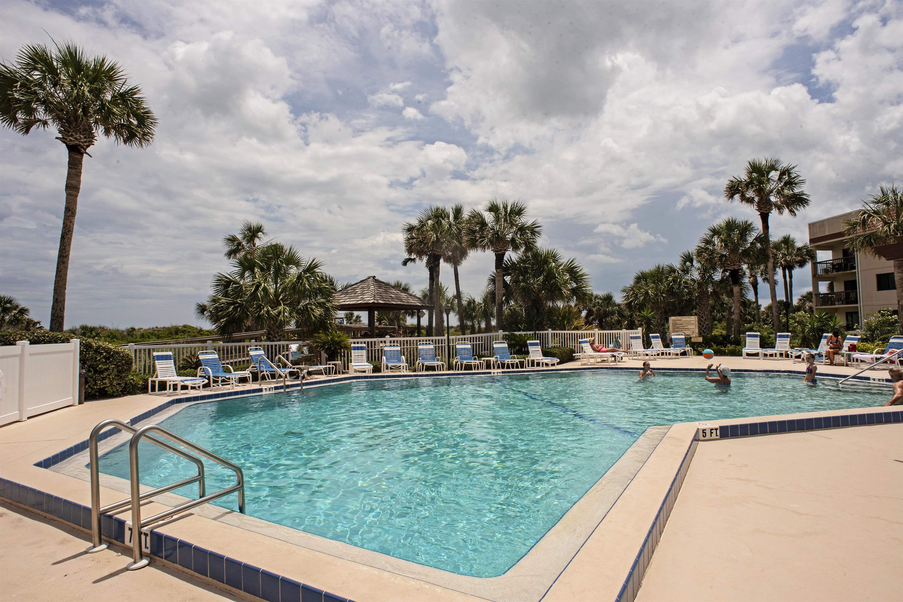4250 A1A South, Unit O23 St. Augustine, FL 32080 - Photo 22 of 38 a view of a swimming pool and a back yard