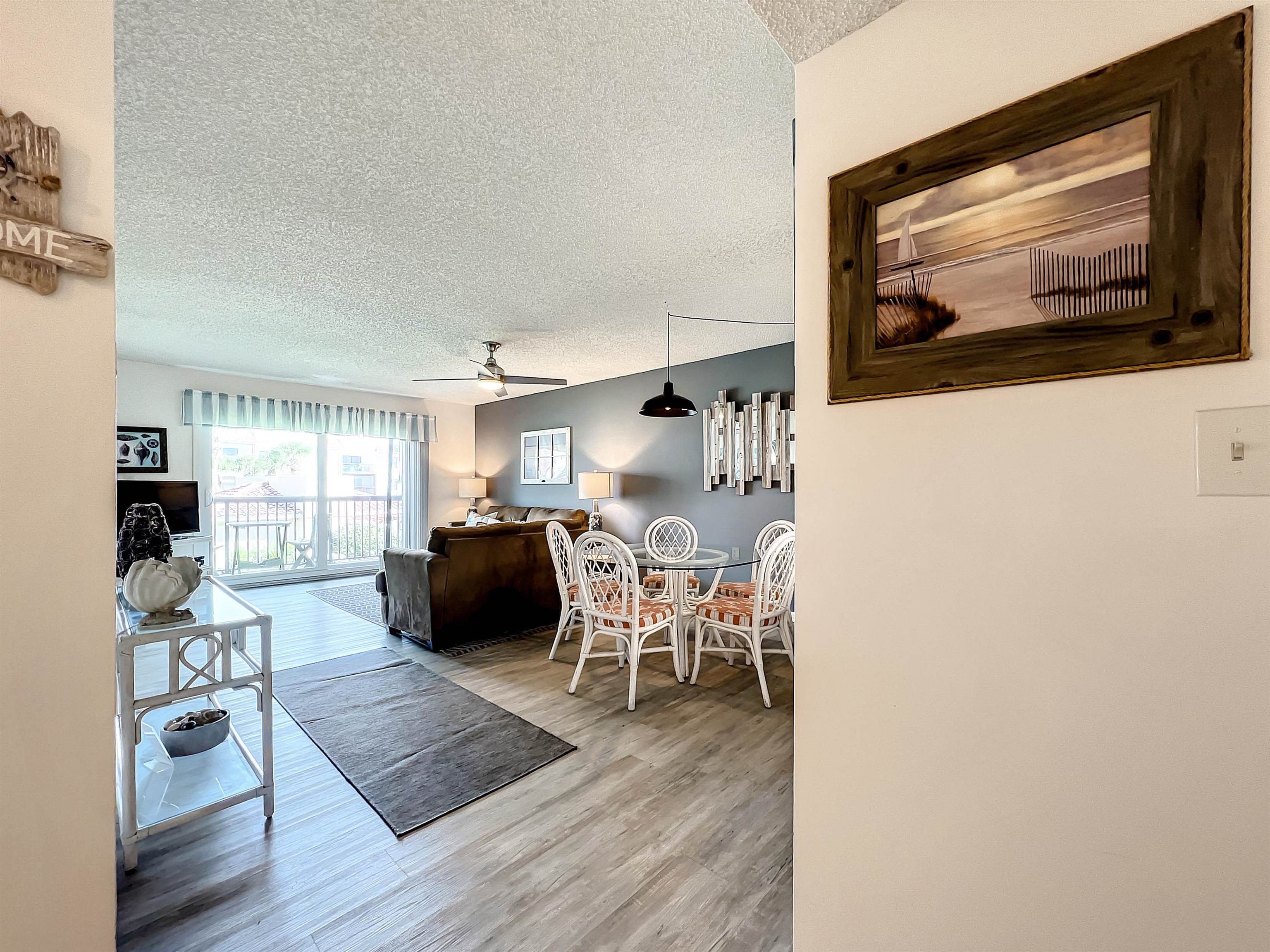 4250 A1A South, Unit O23 St. Augustine, FL 32080 - Photo 4 of 38 a living room with furniture and a flat screen tv