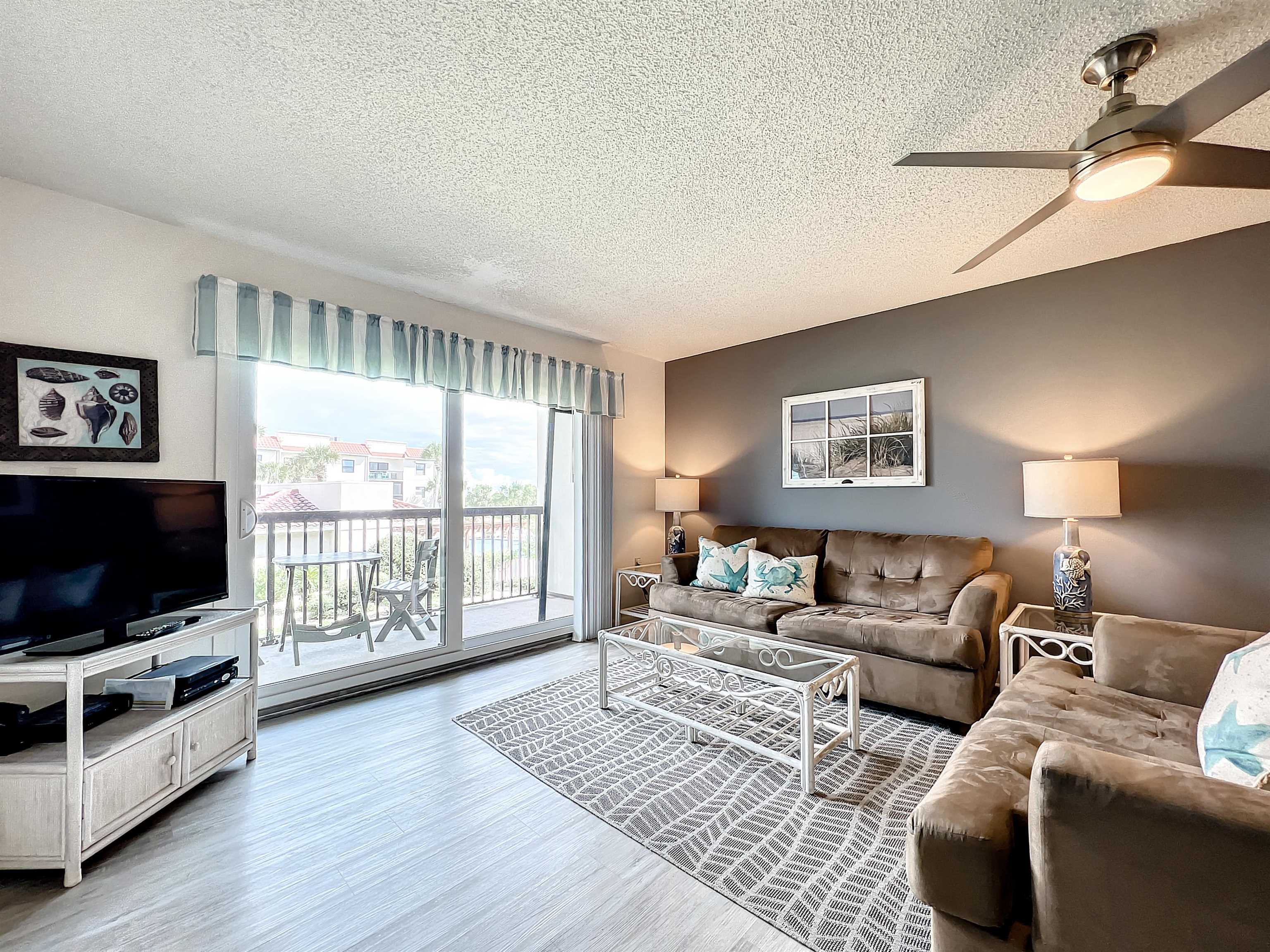 4250 A1A South, Unit O23 St. Augustine, FL 32080 - Photo 9 of 38 a living room with furniture and a flat screen tv