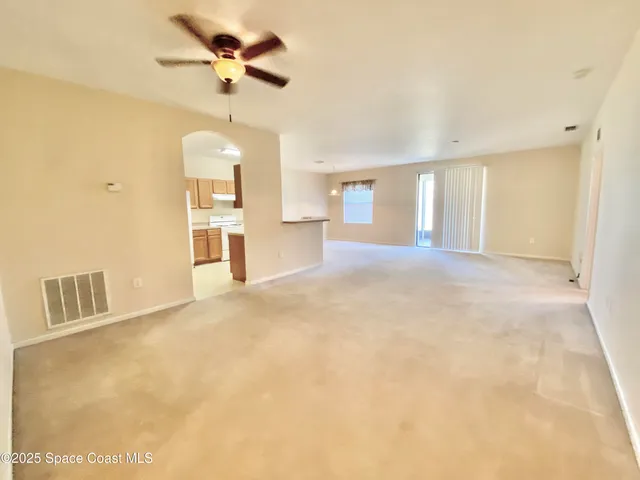 a view of a kitchen with a sink and a cabinet