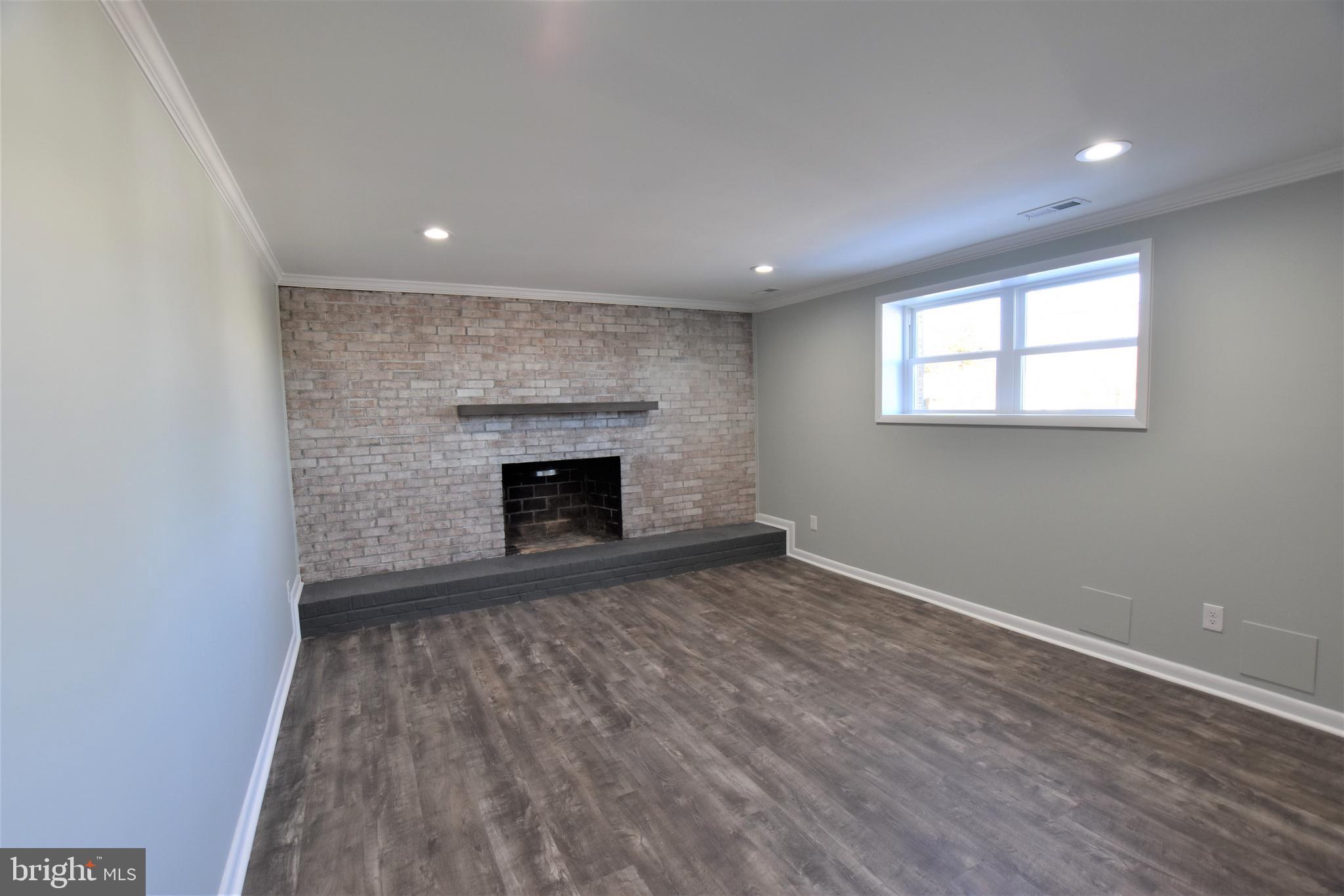 2939 Northwind Road Baltimore, MD 21234 - Photo 14 of 19 Family room on Lower Level, Wood Burning Fireplace