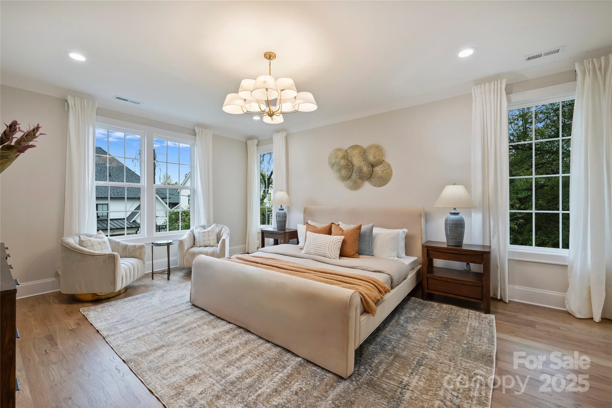 522 Greystone Road Charlotte, NC 28209 - Photo 14 of 23 a bedroom with a large bed and a chandelier