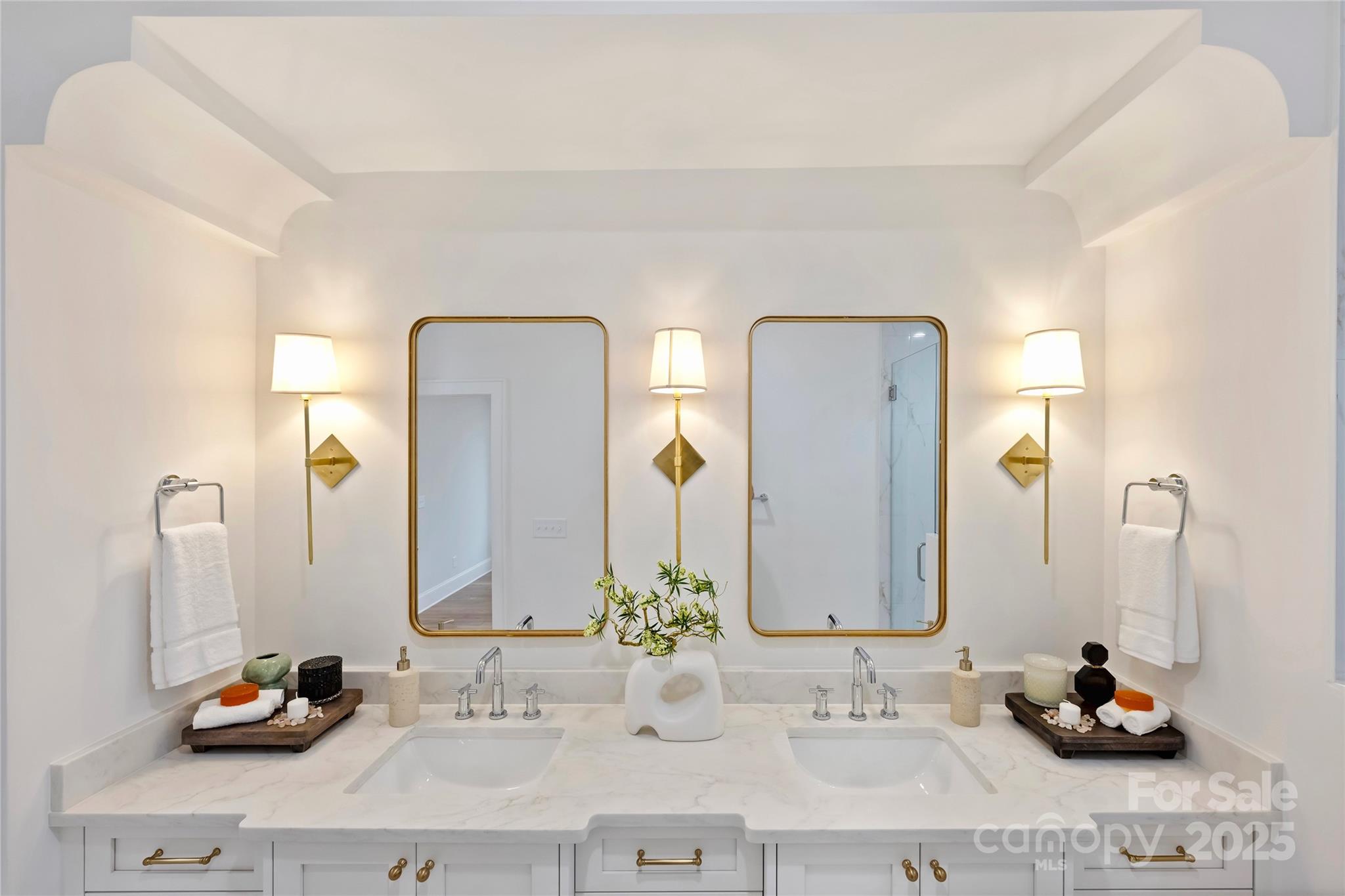 522 Greystone Road Charlotte, NC 28209 - Photo 16 of 23 a bathroom with double vanity sinks and a mirror