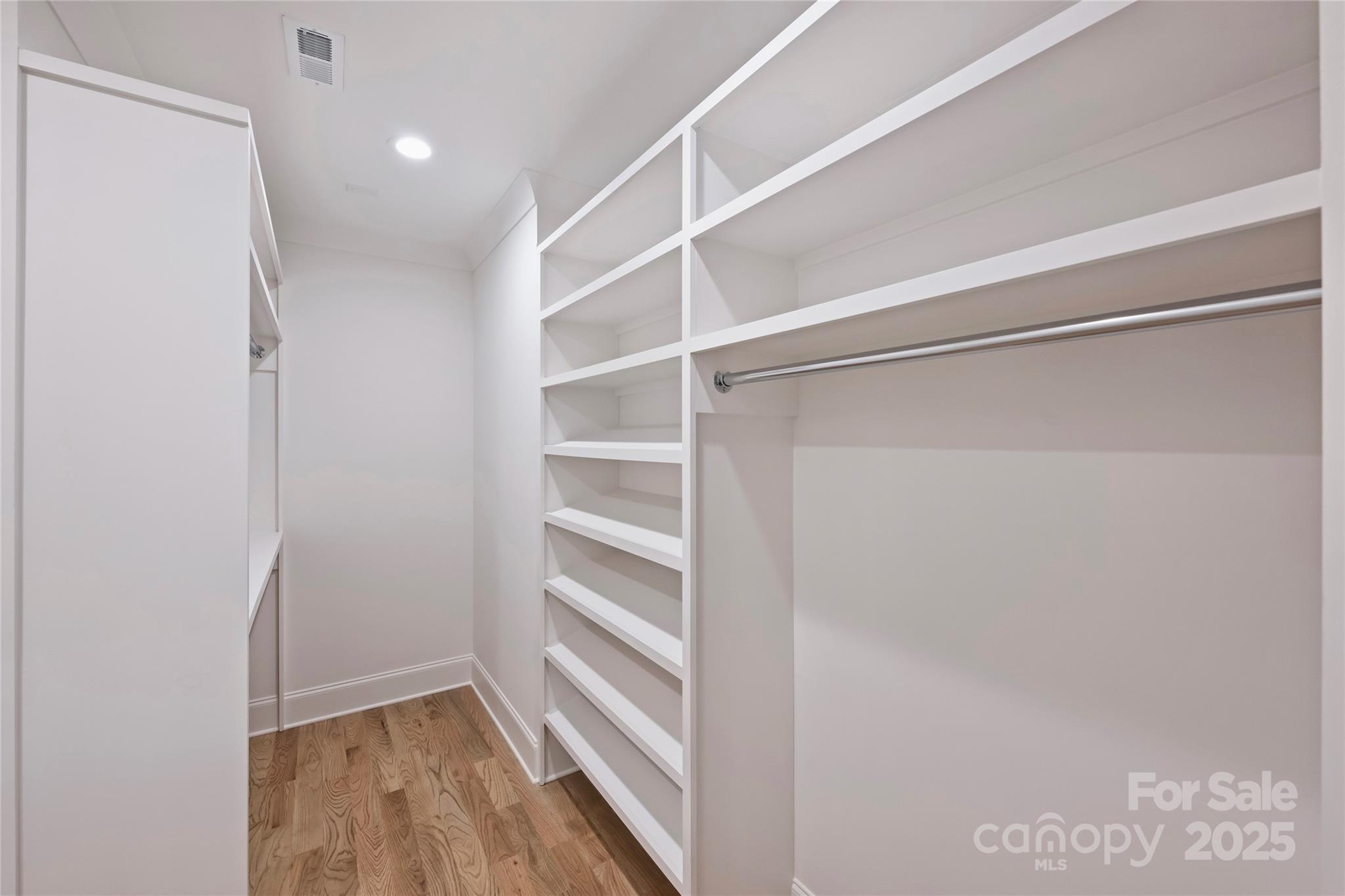 522 Greystone Road Charlotte, NC 28209 - Photo 17 of 23 a view of walk in closet with empty racks