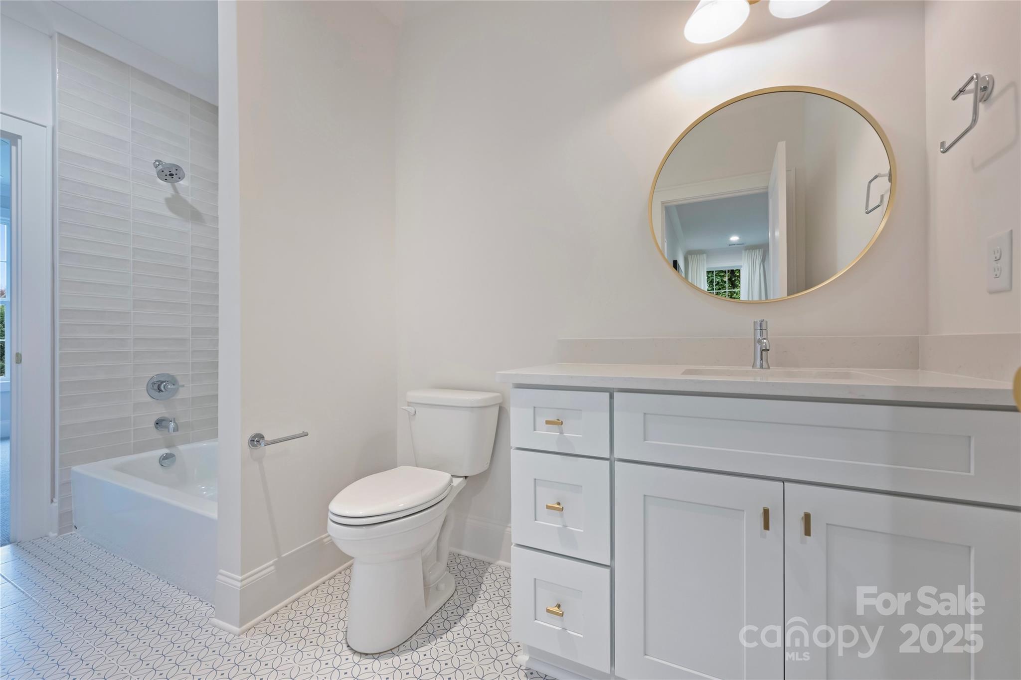 522 Greystone Road Charlotte, NC 28209 - Photo 19 of 23 a bathroom with a toilet a sink and mirror
