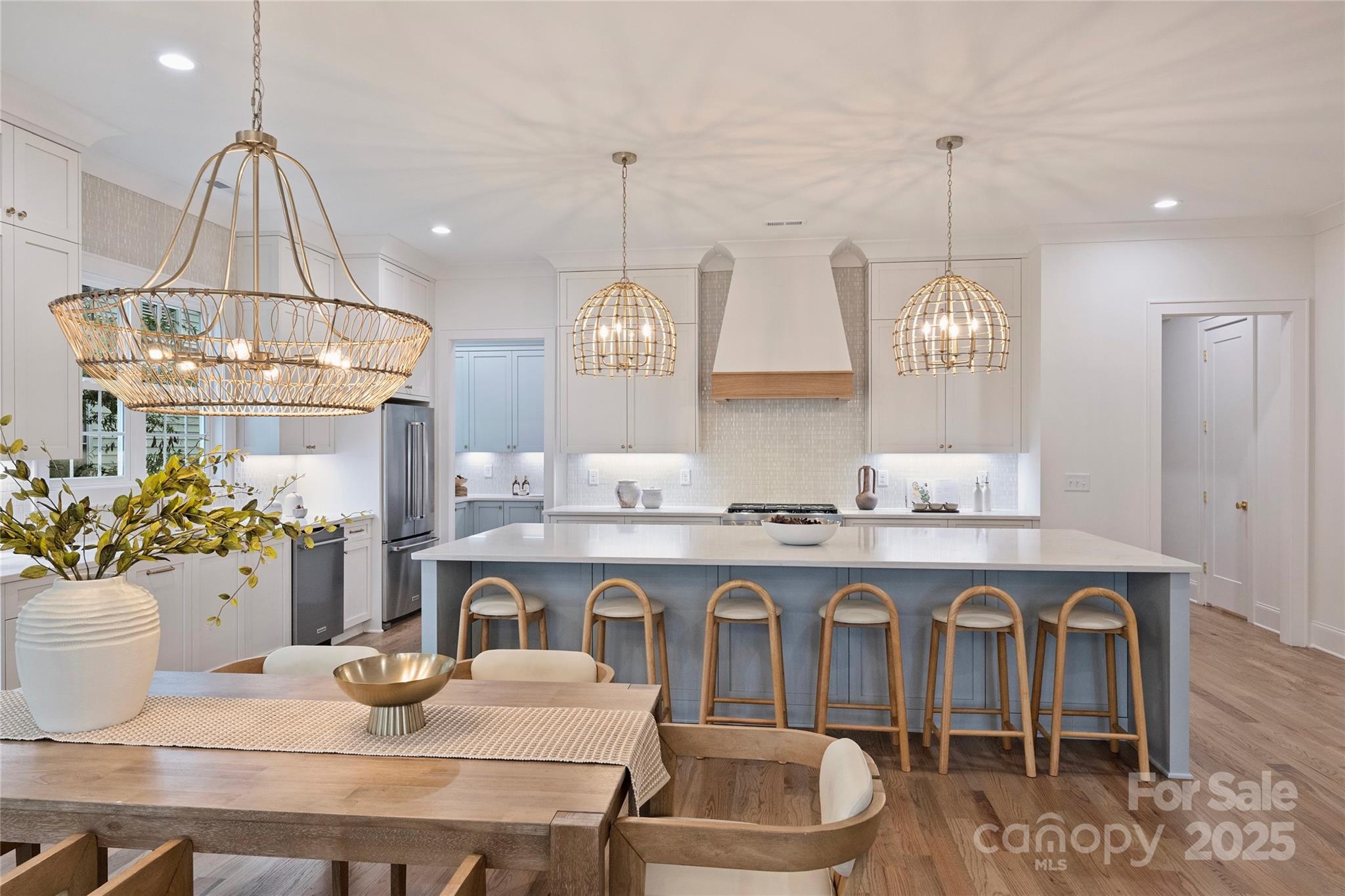 522 Greystone Road Charlotte, NC 28209 - Photo 6 of 23 a kitchen with kitchen island granite countertop a sink a center island and cabinets