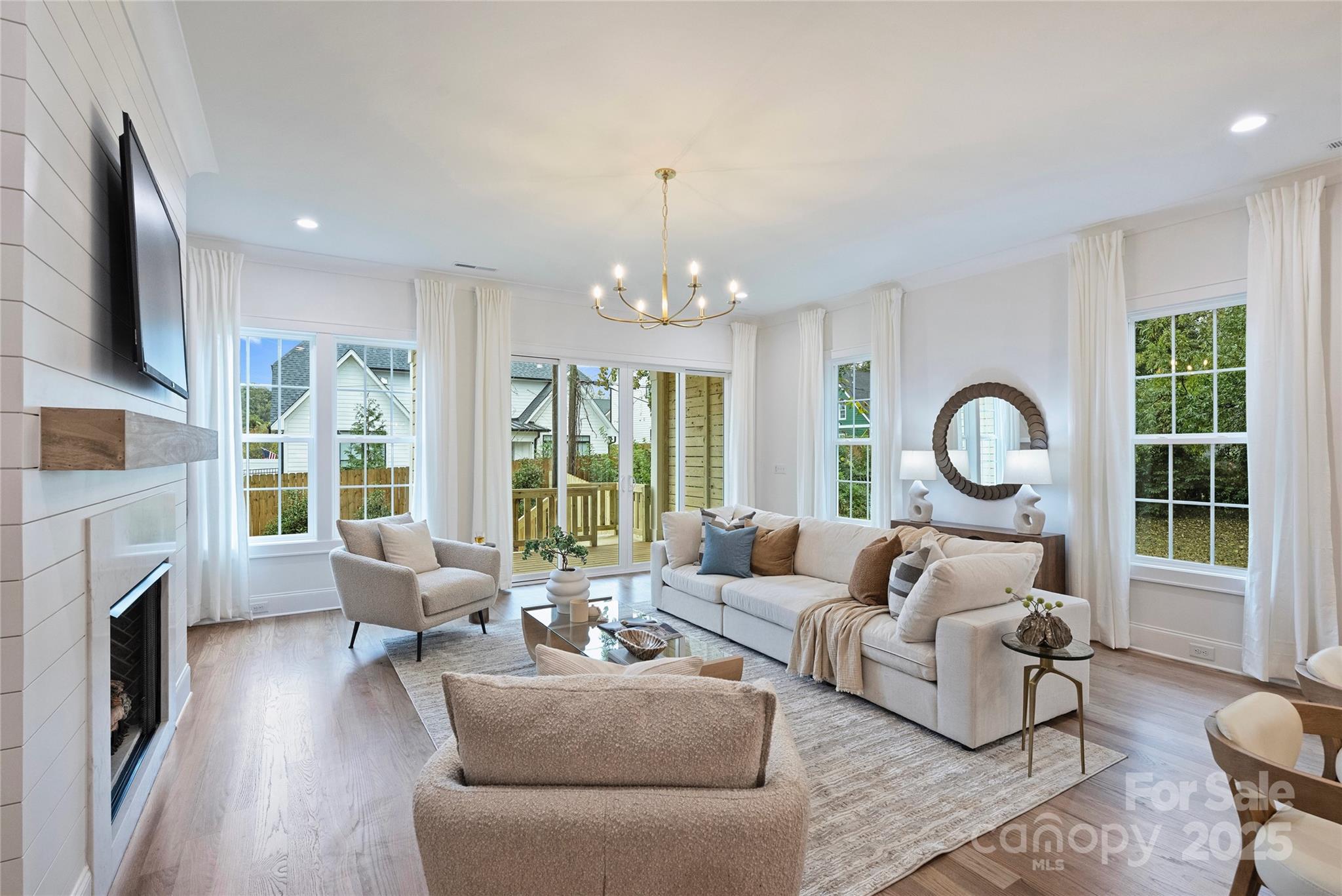 522 Greystone Road Charlotte, NC 28209 - Photo 9 of 23 a living room with fireplace furniture and a large window