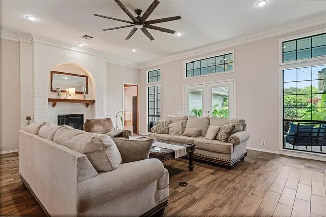 a living room with furniture and a fireplace