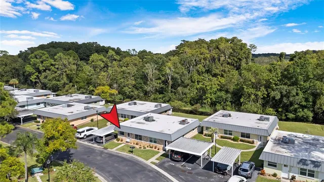 an aerial view of a houses with a yard