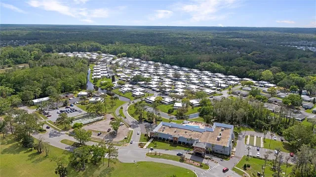 a balcony with wooden floor and city view