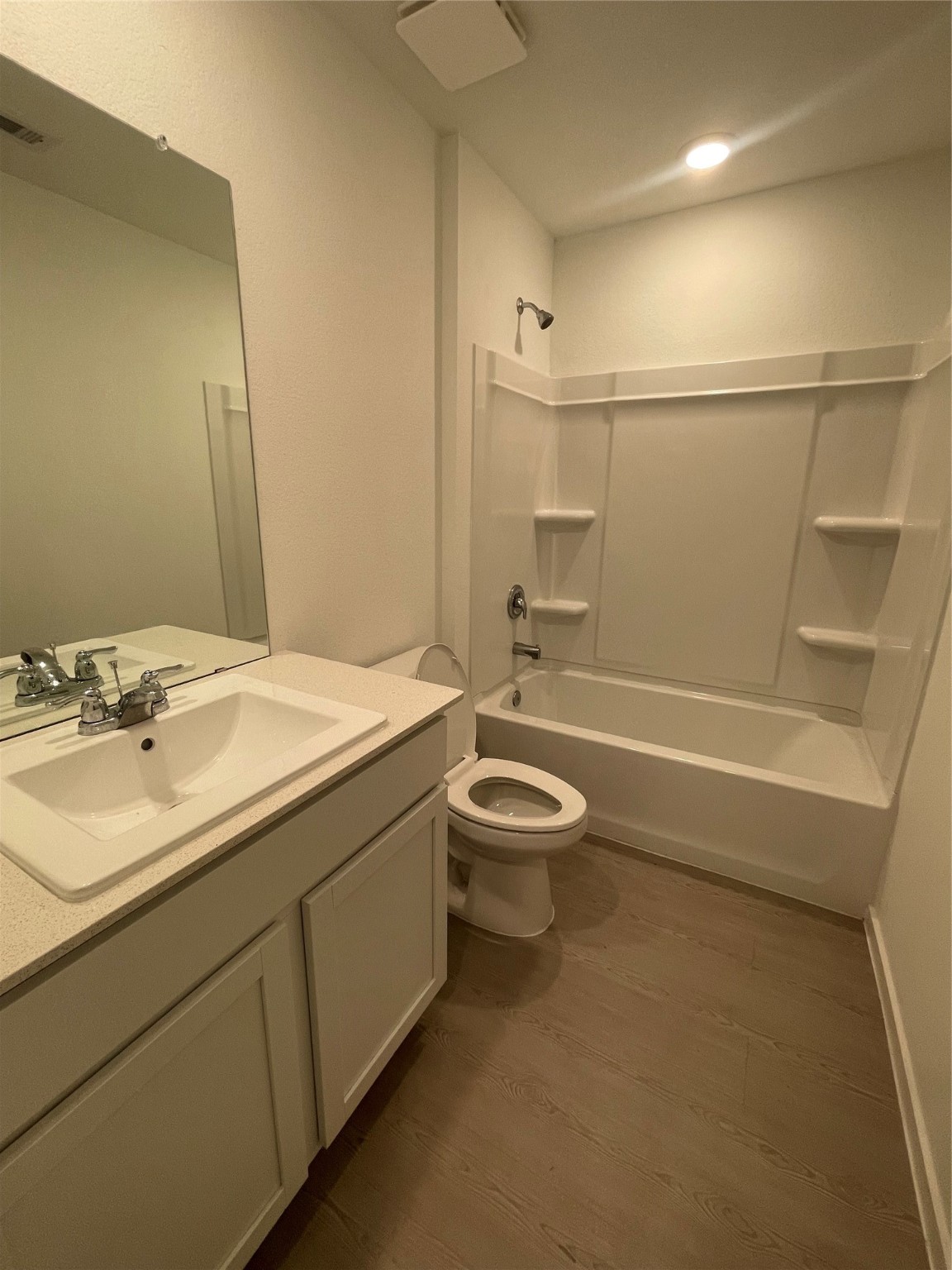 112 Stran Street Wharton, TX 77488 - Photo 19 of 23 This full bath maintains the home’s polished feel with a clean-lined vanity and a classic shower-tub combination.