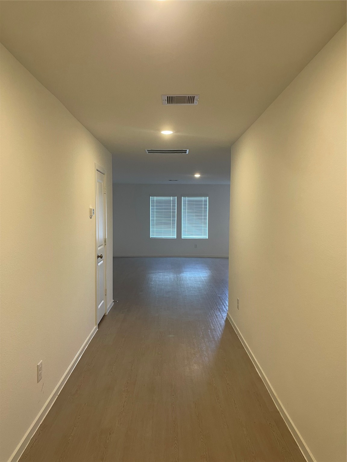112 Stran Street Wharton, TX 77488 - Photo 3 of 23 Upon entry, the home reveals its intuitive flow, providing a clear, light-filled view toward the main living space within.