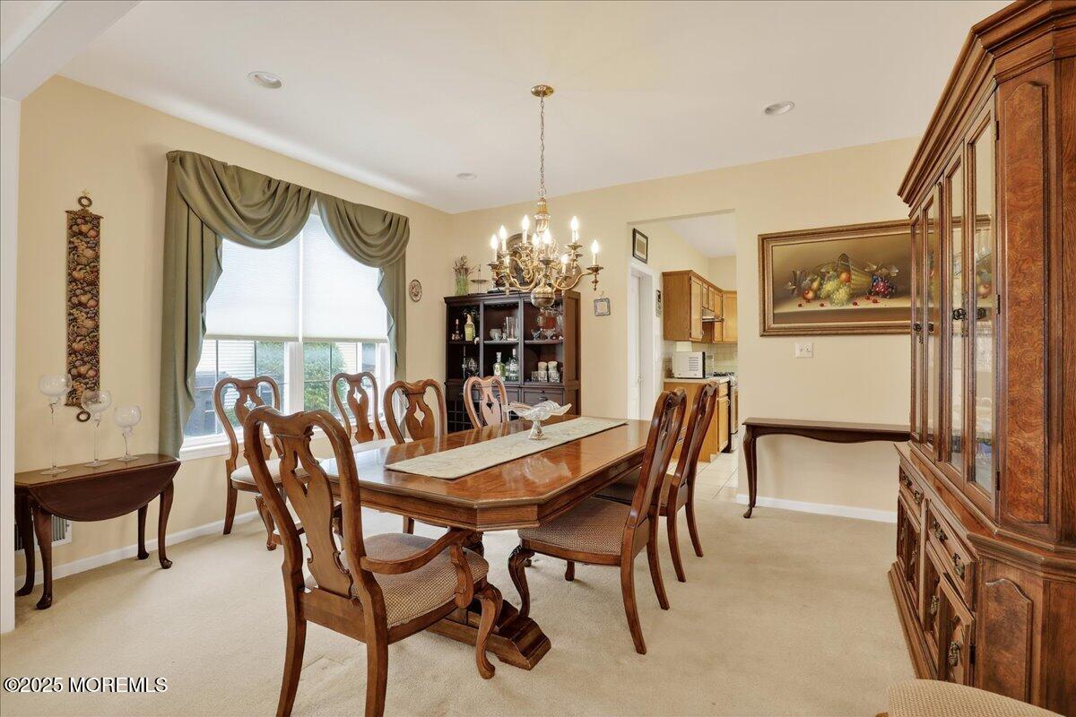 508 Lanzaro Drive Morganville, NJ 07751 - Photo 11 of 48 a view of a dining room with furniture and window