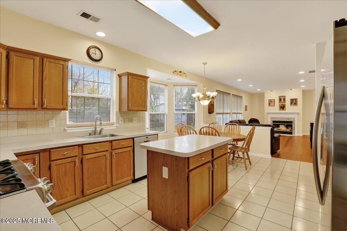 508 Lanzaro Drive Morganville, NJ 07751 - Photo 16 of 48 a kitchen with a sink a counter top space and appliances