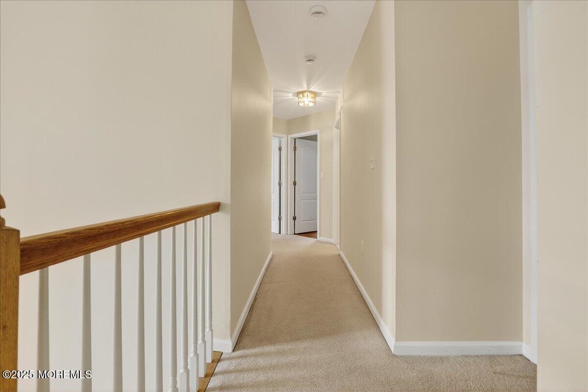 508 Lanzaro Drive Morganville, NJ 07751 - Photo 24 of 48 a view of a hallway with wooden floor