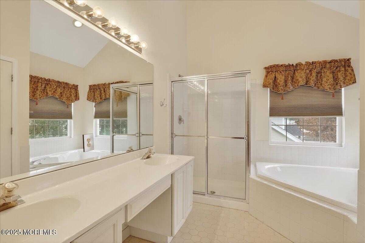 508 Lanzaro Drive Morganville, NJ 07751 - Photo 29 of 48 a bathroom with a bathtub and a shower
