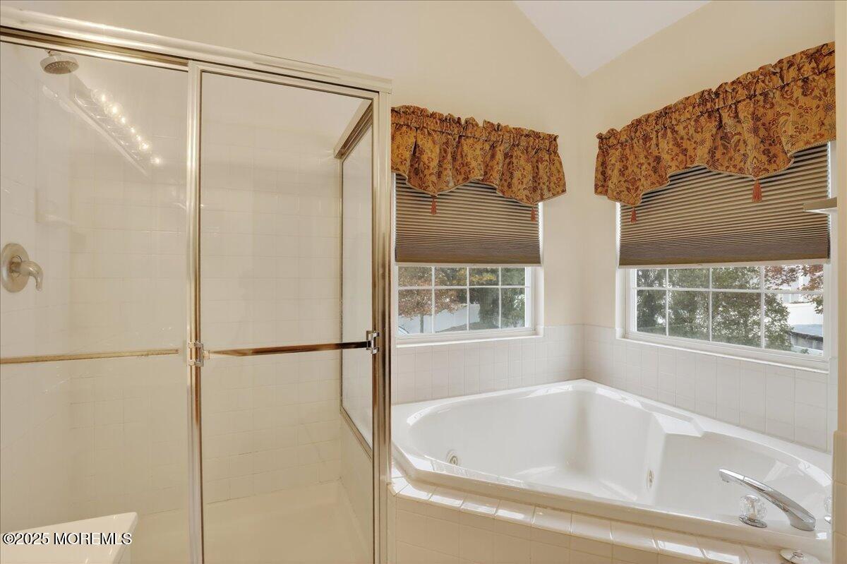 508 Lanzaro Drive Morganville, NJ 07751 - Photo 30 of 48 a bathroom with a bathtub and a shower