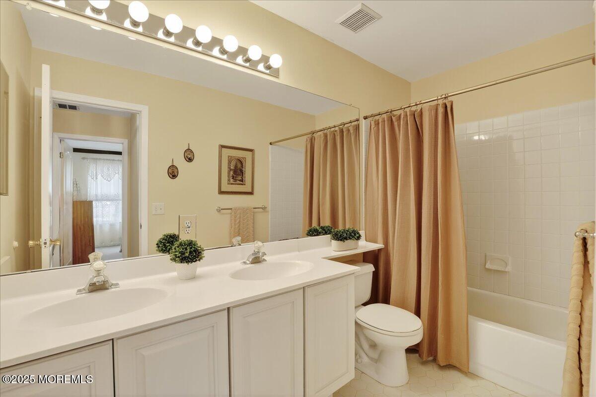 508 Lanzaro Drive Morganville, NJ 07751 - Photo 33 of 48 a bathroom with a sink toilet and shower