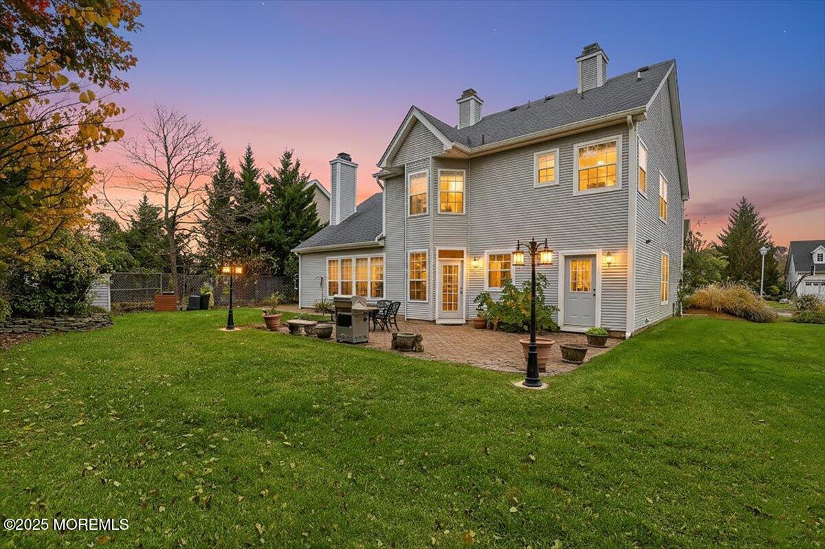 508 Lanzaro Drive Morganville, NJ 07751 - Photo 38 of 48 a front view of house with yard and outdoor seating