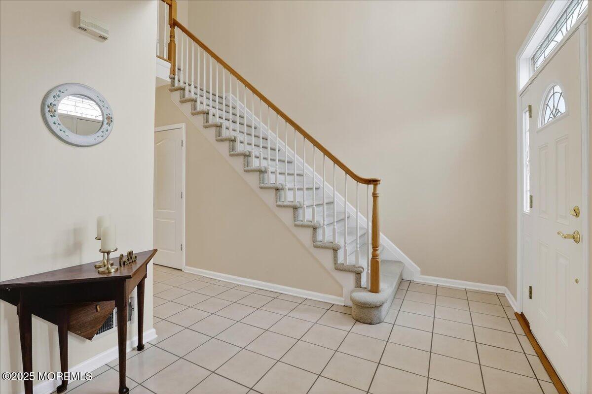 508 Lanzaro Drive Morganville, NJ 07751 - Photo 7 of 48 a view of entryway with wooden floor
