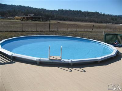 21125 A Loconomi Road Middletown, CA 95461 - Photo 2 of 12 a view of a swimming pool with lake and mountain view