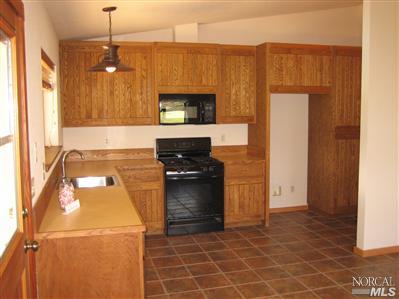 21125 A Loconomi Road Middletown, CA 95461 - Photo 4 of 12 a kitchen with a sink cabinets and appliances